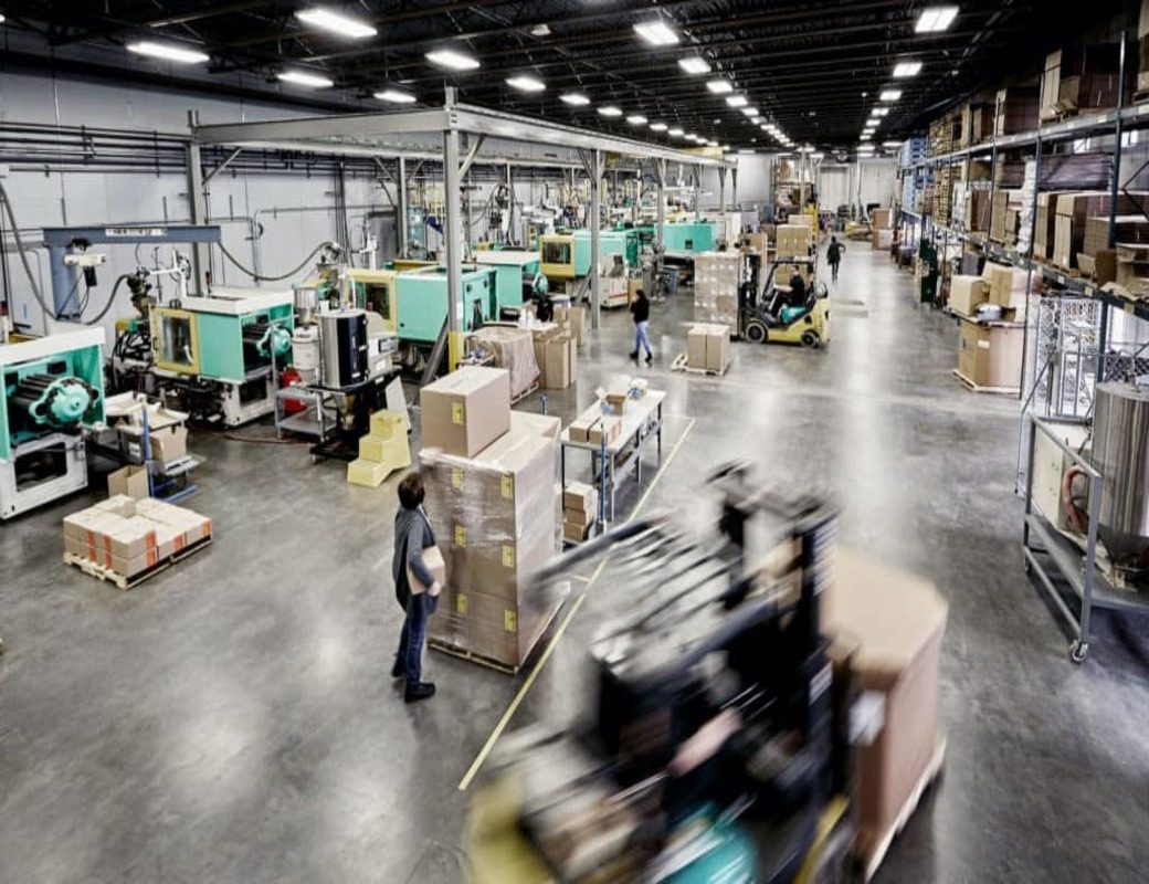 Rows of injection molding presses on the Plastic Alternatives production floor in Minnesota
