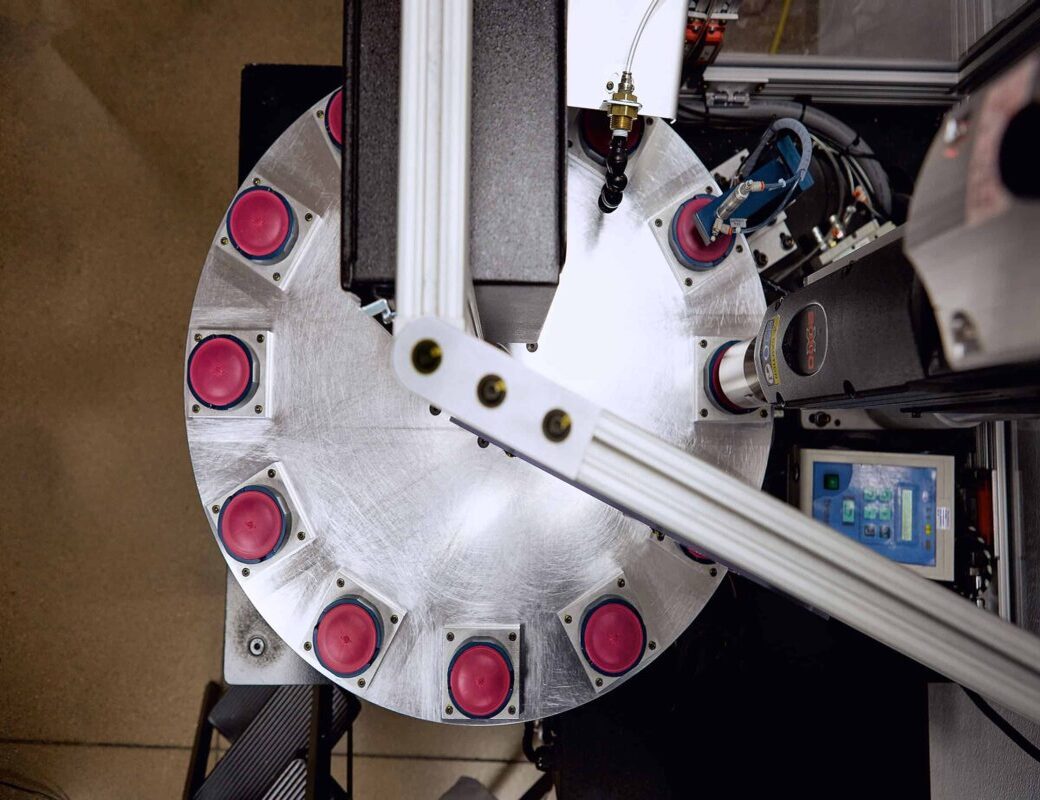 Rotary molding fixture producing precision medical-grade plastic parts