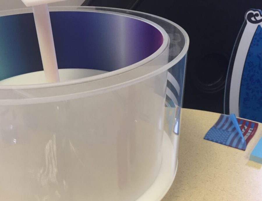 Curved formed acrylic display fabricated from sheet plastic