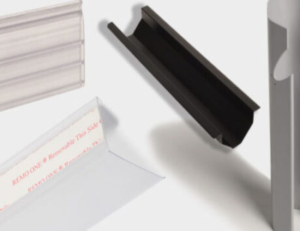 Clear extruded plastic profile used as a shelf-edge label holder